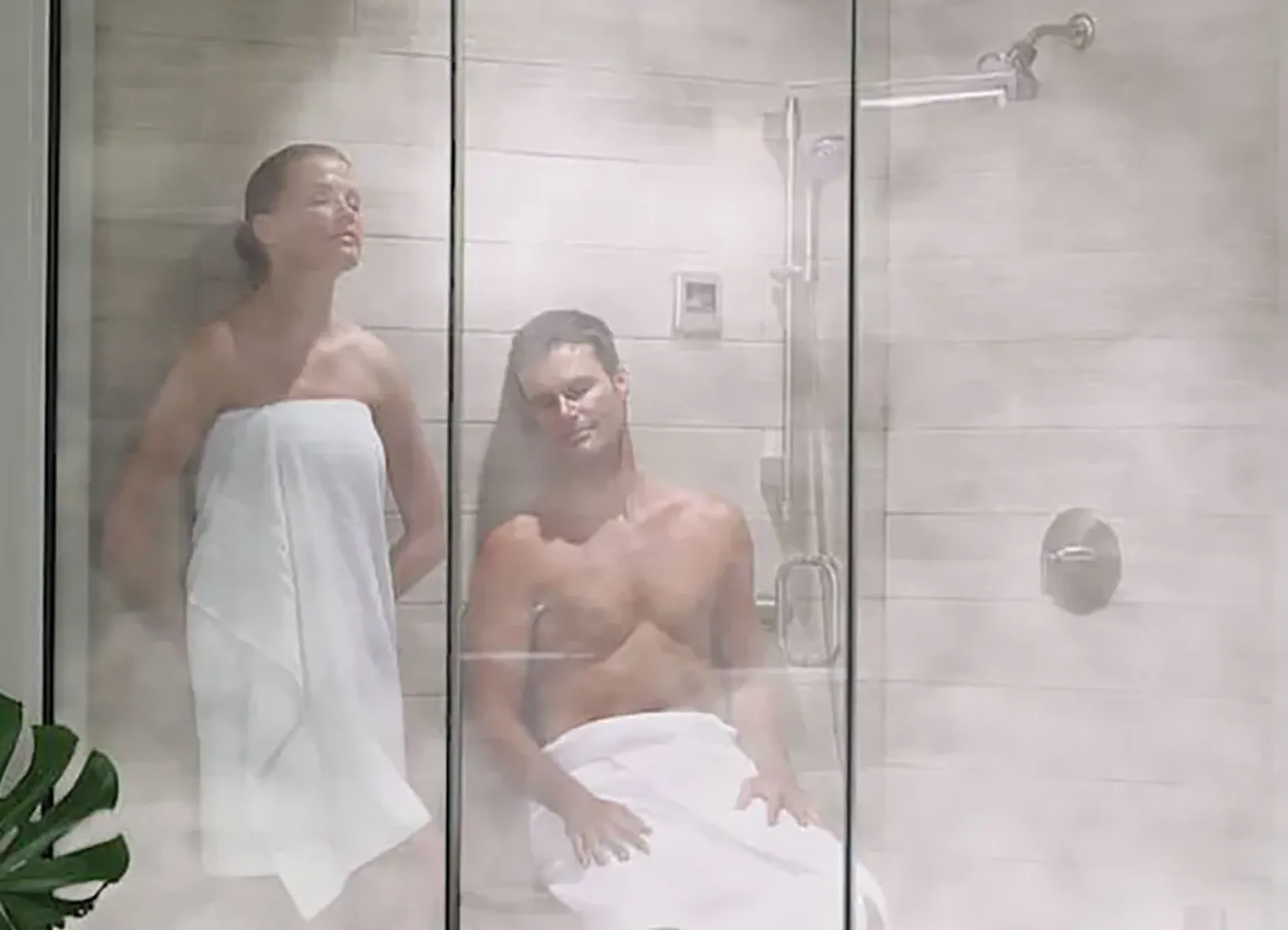 Technician installing a steam shower in a Calgary bathroom during a renovation