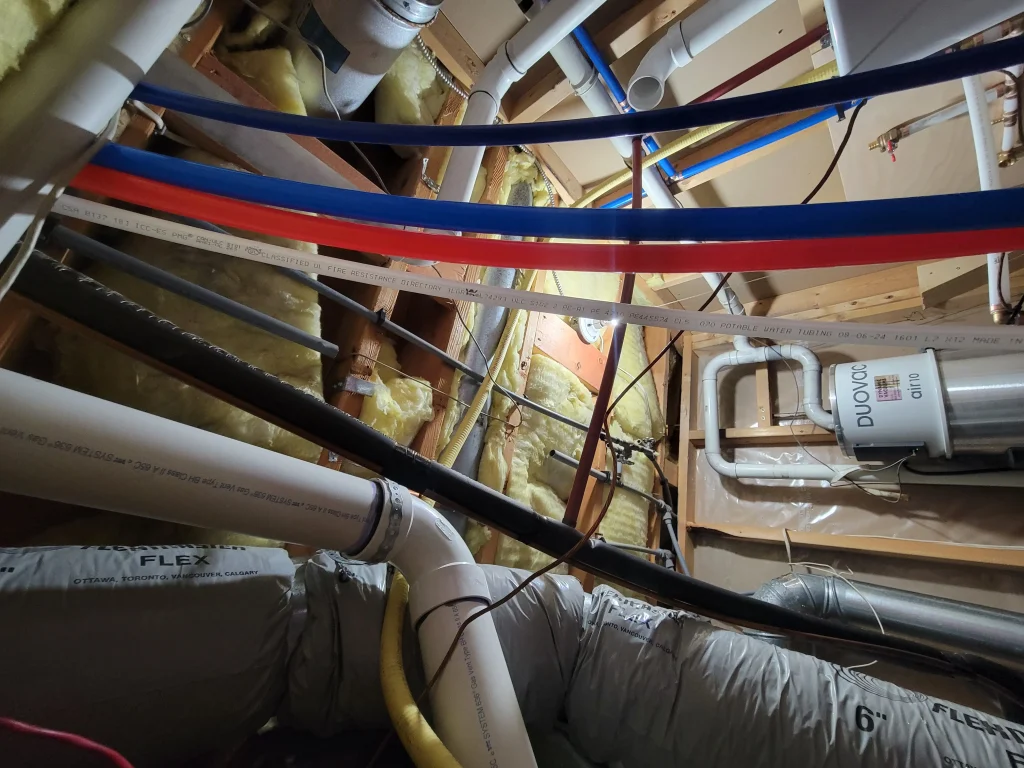AIC plumber replacing Poly-B piping with PEX in a Calgary home