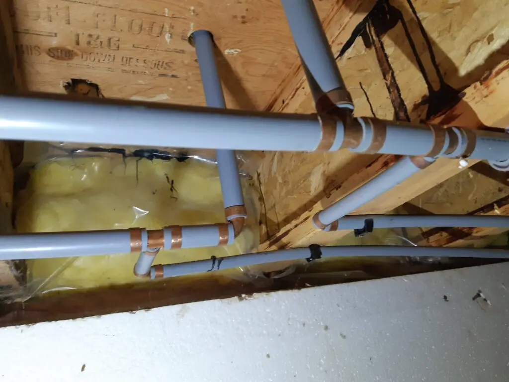 Poly-B pipe with copper fittings in a Calgary home